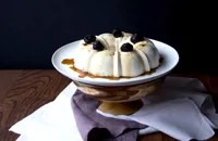 Coconut pudding with prune sauce