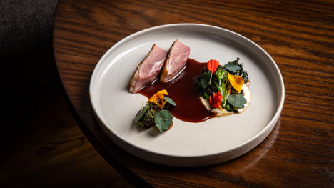 Barbecued dry-aged duck with purple sprouting broccoli, sherry and ajo bianco