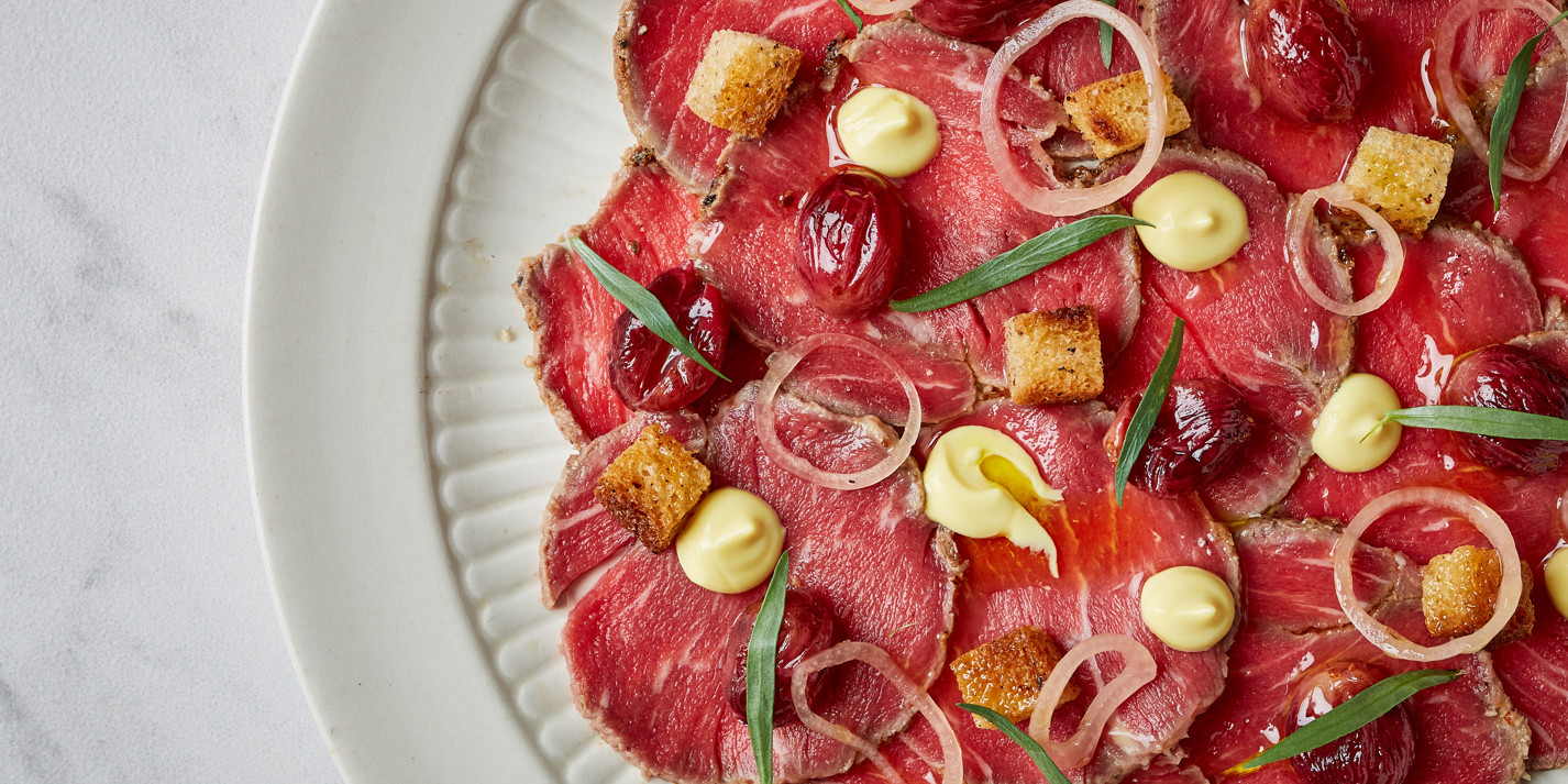 image of Horseradish Beef Carpaccio With Mustard, Tarragon and Roast Grapes recipe by Great British Chefs