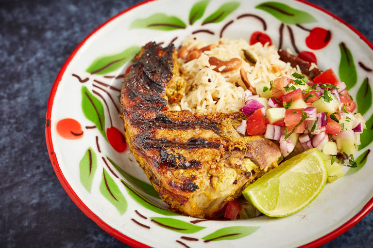 Barbecued lamb chops with cashew pilaf and chopped salad