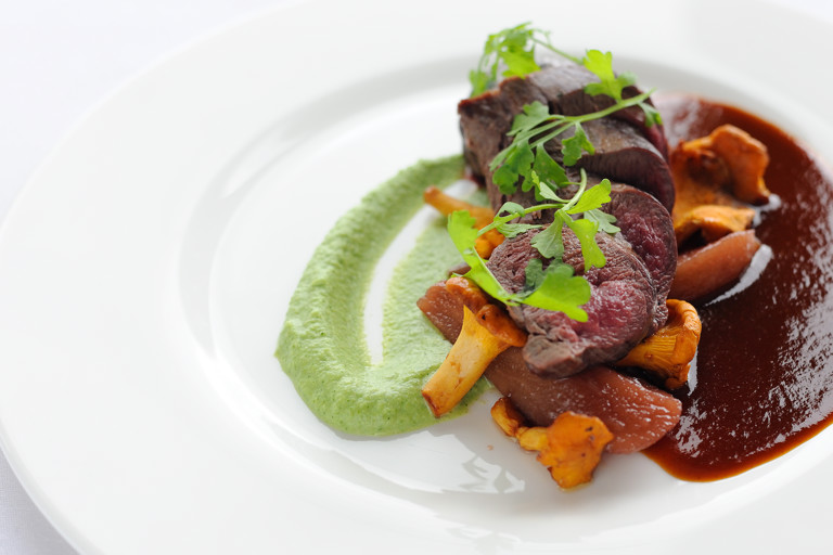 Loin of venison with broccoli and stilton purée and red wine sauce