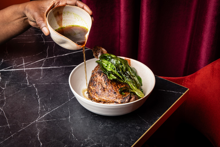 Spiced duck leg confit in pepe soup broth