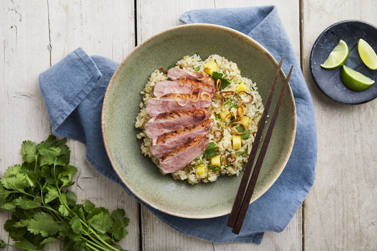 Duck breast with red curry-infused jasmine rice