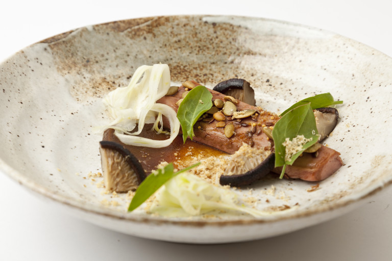 Duck breast glazed in soy with date purée, pickled shiitake, fried walnut, pumpkin seeds