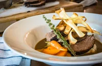 Pot roasted beef brisket with root vegetable mash, parsnip crisps and horseradish 