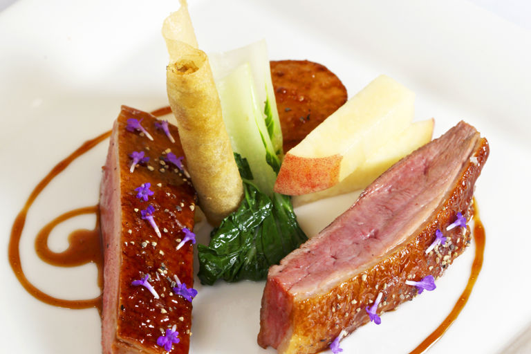 Roast crown of duck with turnip, peach, duck croustillant and red wine jus