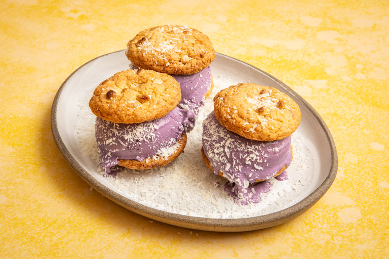 Ube ice cream sandwich with coconut white chocolate chip cookies