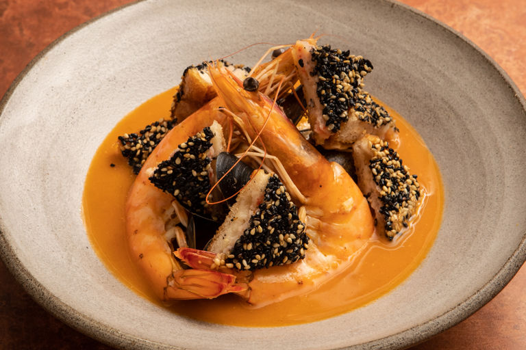Spiced seafood bisque with sesame prawn croutons