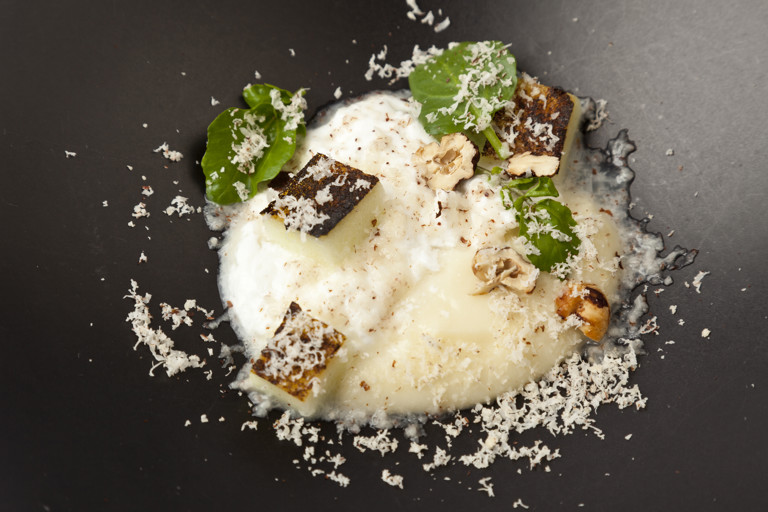 Burnt apples with goat's curd, cobnut and watercress
