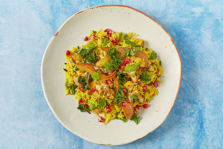 Saffron and cinnamon roast cauliflower, roast pear, basmati and wild rice salad, with tahini, zhug, crispy kale 