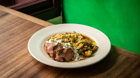 Marinated leg of lamb with chickpea purée, slow-cooked courgettes and caçik