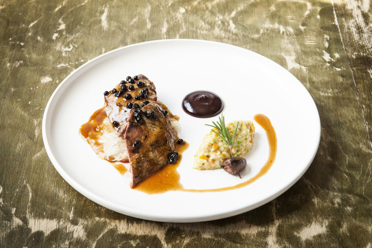 Roast Yorkshire grouse with creamed root vegetables, stuffed cabbage and elderberries