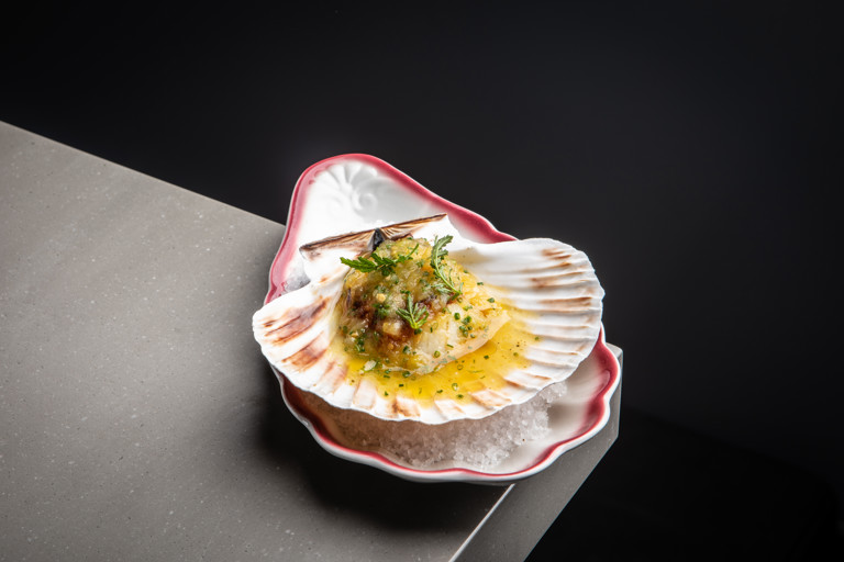 Coal-roasted scallop with sheep’s cheese, Great White tomato and brown butter