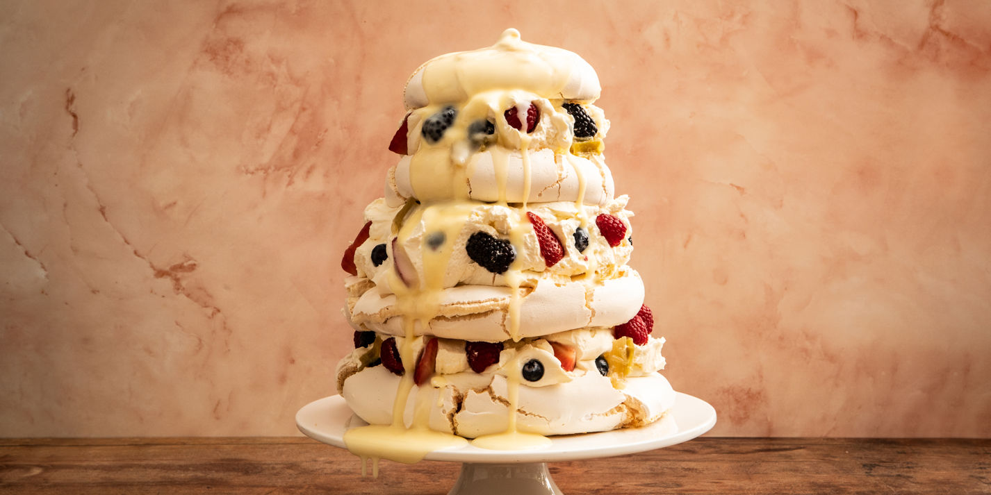 Mixed Berry Pavlova With Poached Rhubarb and Orange-Ginger Curd Recipe - Great British Chefs