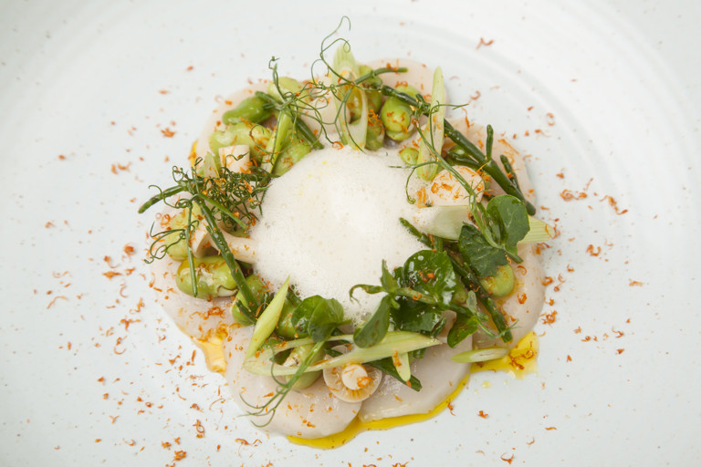 Scallops, summer greens, yuzu, soup of Manx queenies and roast shellfish oil