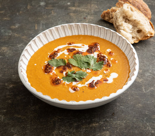 Spiced carrot and red lentil soup with coconut and tamarind chilli oil