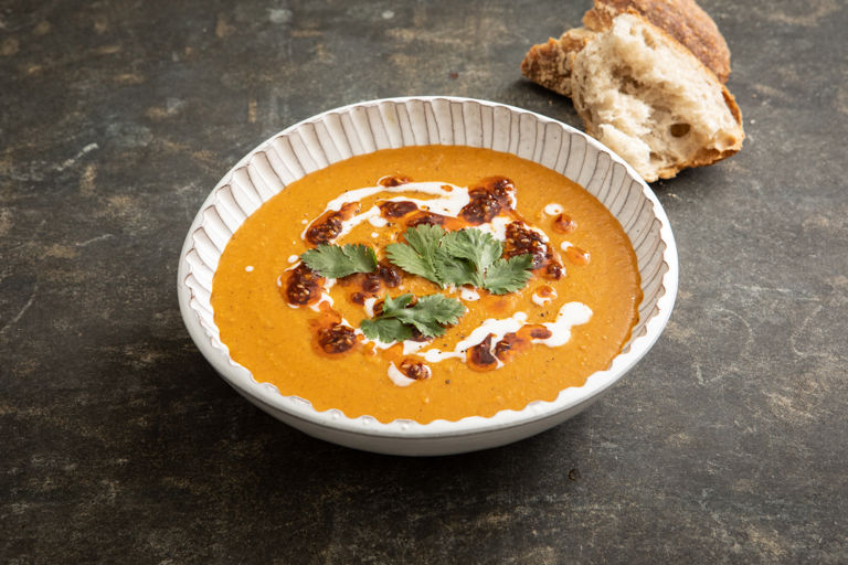 Spiced carrot and red lentil soup with coconut and tamarind chilli oil
