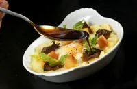 Baked hen's egg with crushed celeriac, truffle and croutons