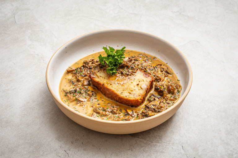 Babka ziemniaczana (Polish potato cake) with wild mushroom sauce