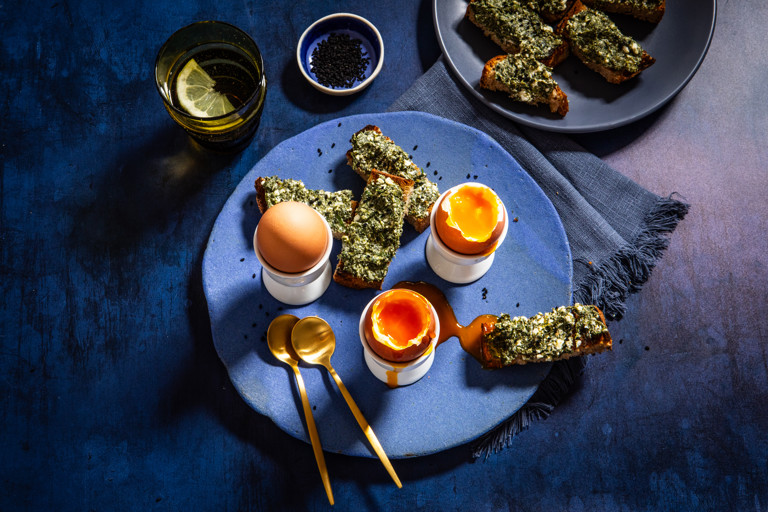 Runny boiled eggs with spanakopita soldiers 