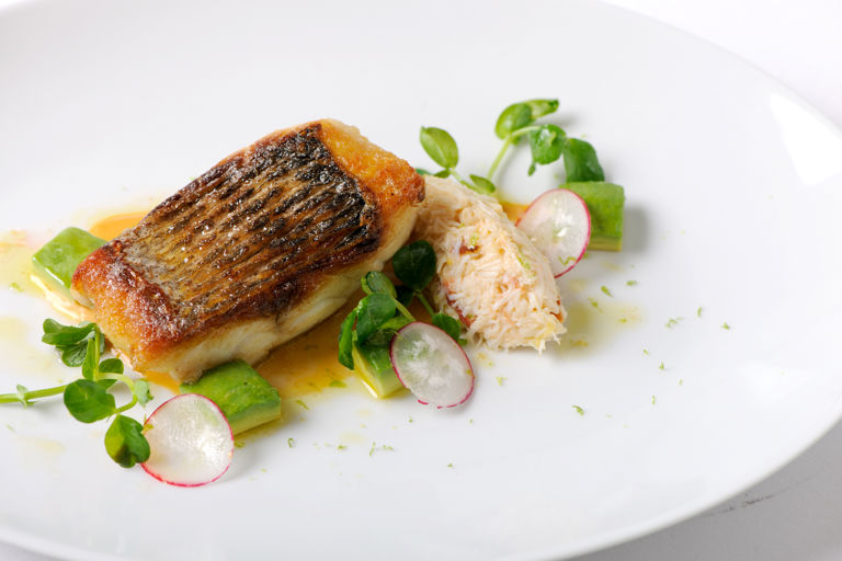 Pan-fried sea bass fillet with white crab salad and brown crab mayonnaise