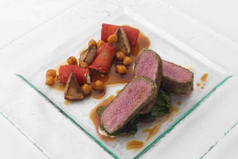 Herb crusted loin of lamb with chickpeas, confit tomato, artichoke and goat’s cheese