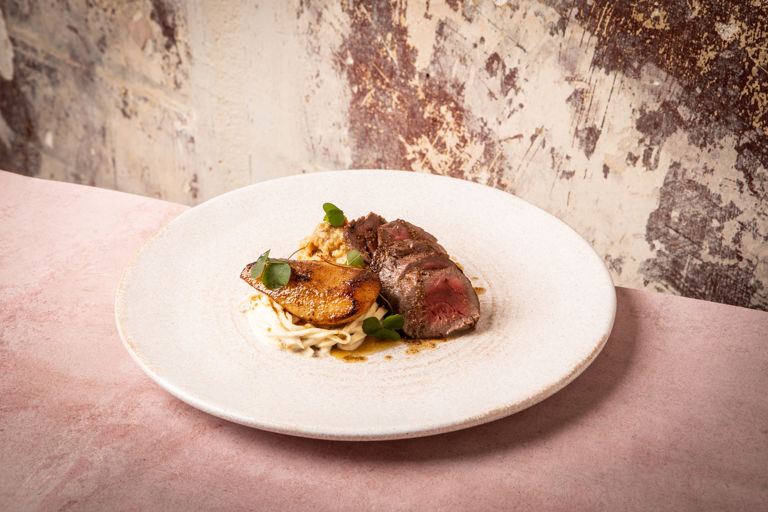 Venison haunch with spiced celeriac, and roasted pear