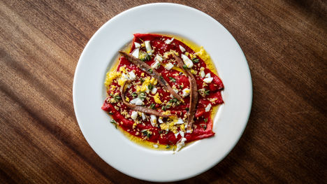 Grilled romero pepper salad with chopped egg and anchovy