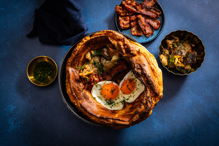 Dutch baby with eggs, bacon and mushrooms