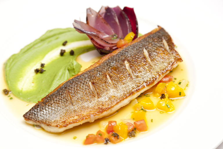 Pan-fried sea bass with broccoli purée and citrus sauce