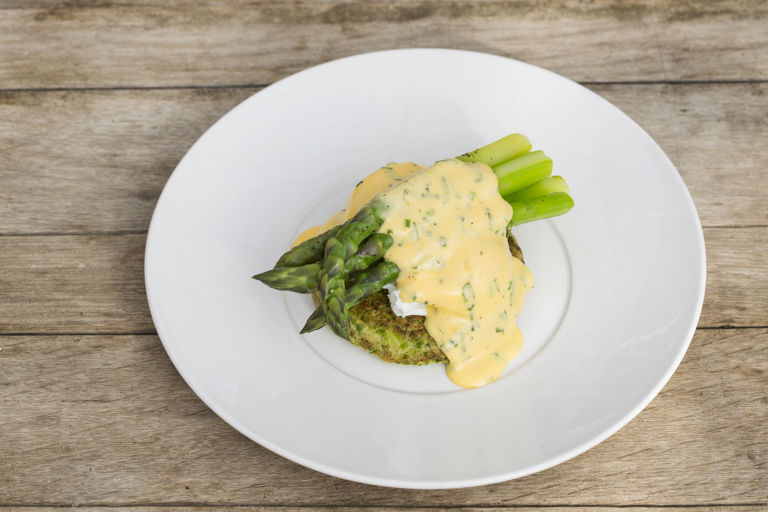 Organic pea pancake, asparagus and poached eggs with a herb sabayon