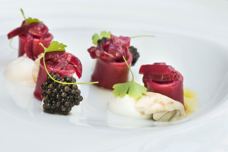 Beetroot pasta, red onion, yoghurt and caviar