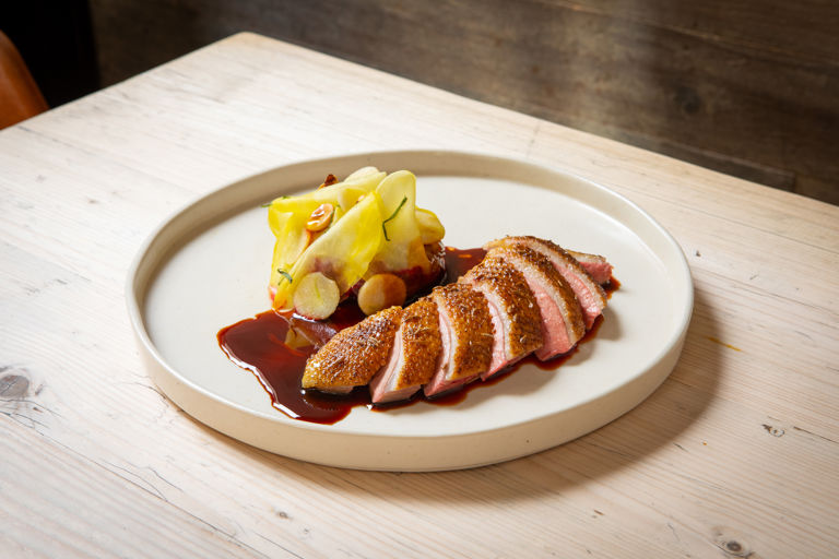 Honey-glazed duck with roast beetroots, hazelnuts and mint jus