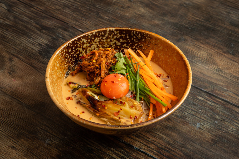 Peanut-sesame soba noodles with pulled pork and braised bok choi