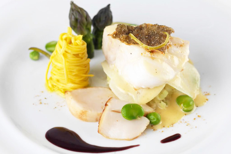 Spiced cod and scallop linguine with a red wine sauce