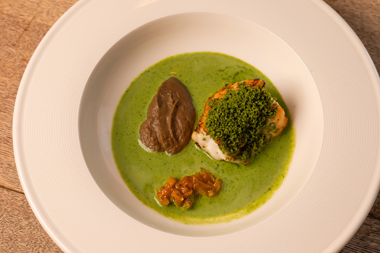 Pistachio monkfish with smoked aubergine purée, buttermilk dressing and lime pickle
