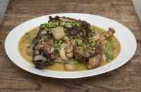 Braised lamb with peas, crème fraiche and mint