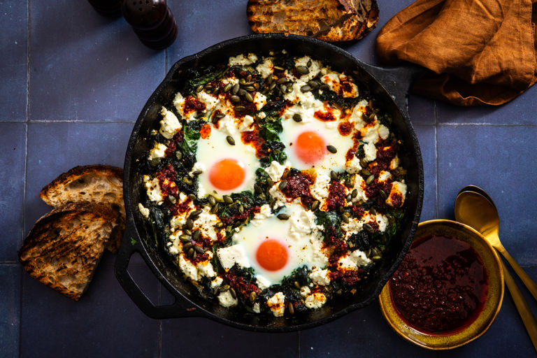 Green shakshuka with rose harissa oil