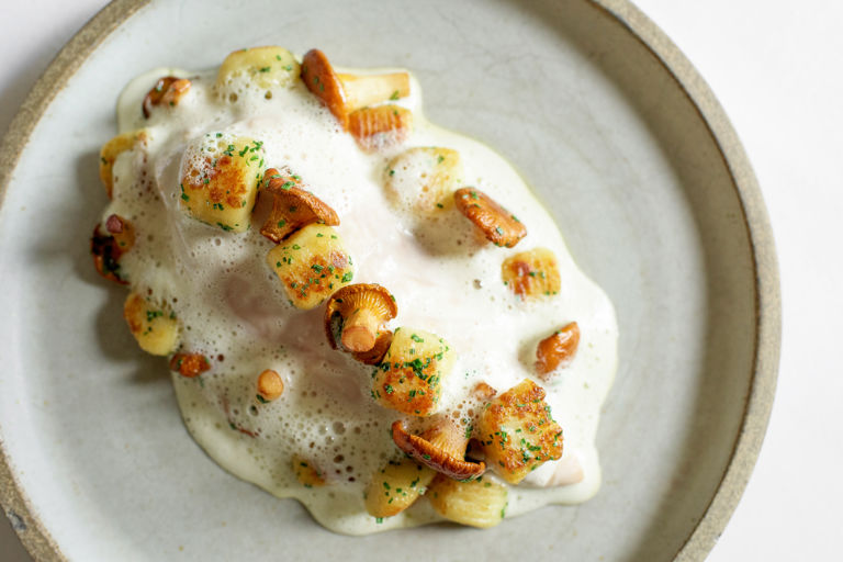 Poached chicken with comté cheese gnocchi, griolle mushrooms and sauce vin jaune