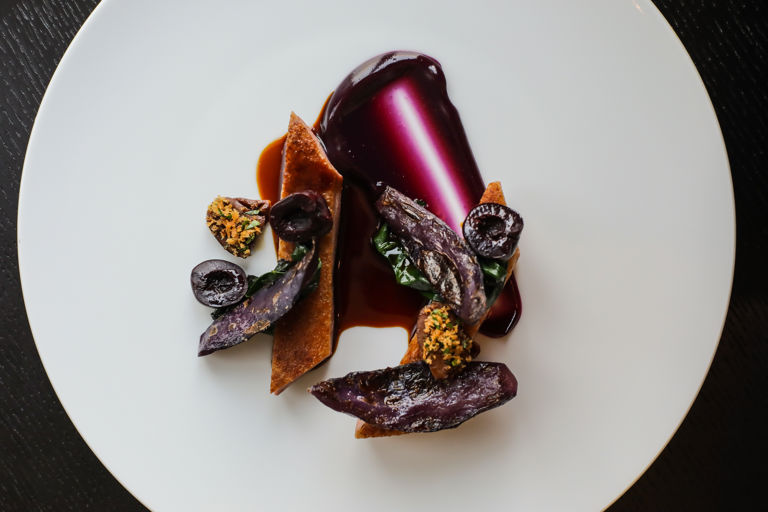 Powdered duck with braised cabbage and pickled cherries