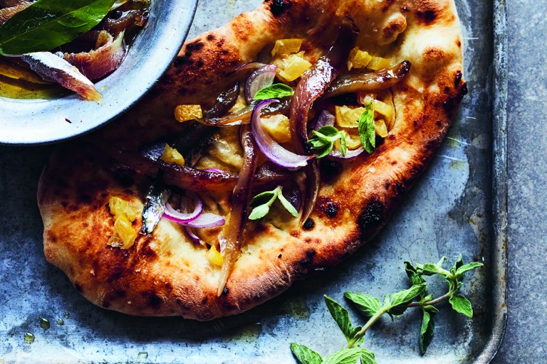 Stone-baked flatbreads with cured sardines