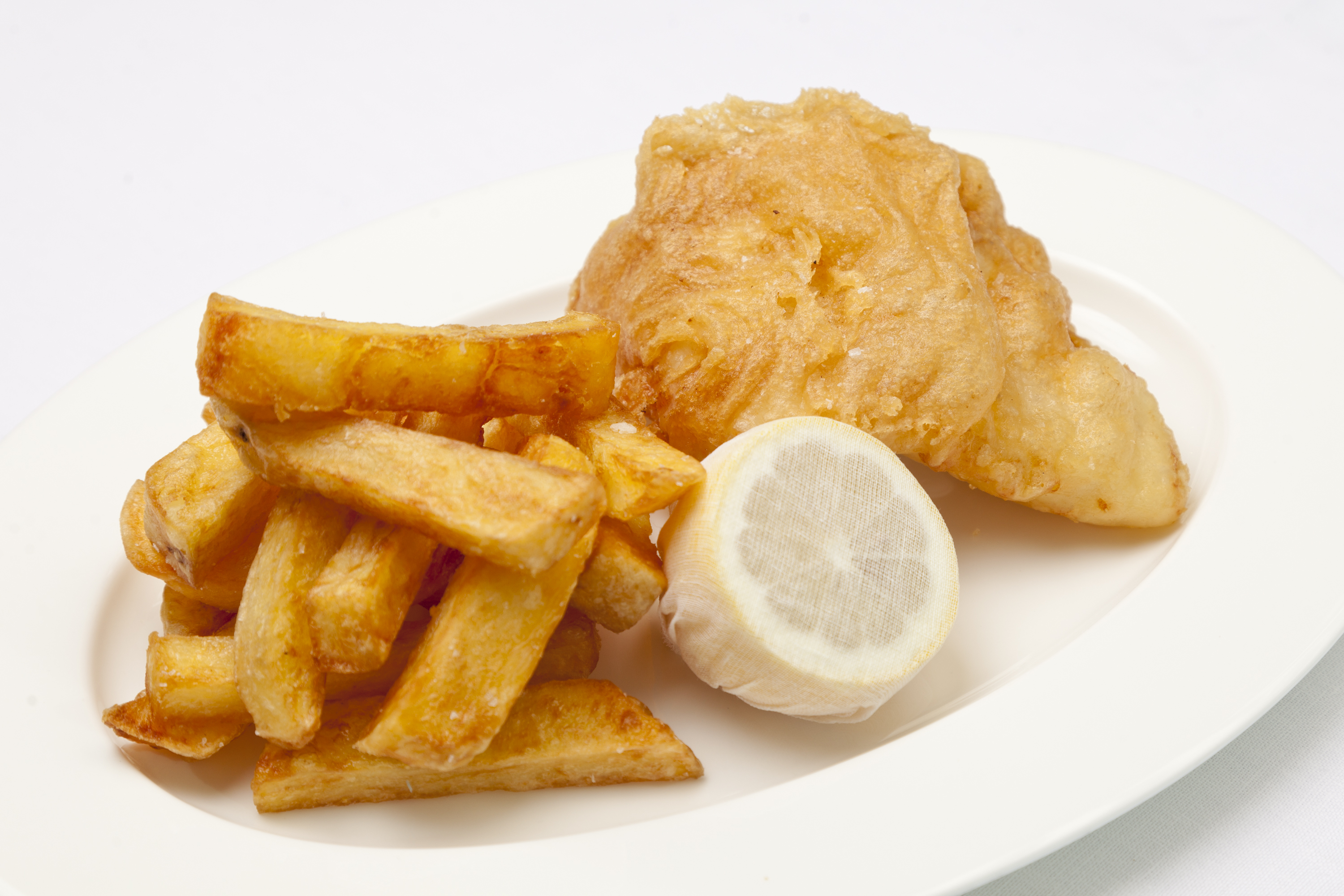 Traditional Homemade British Beer Battered Fish and Chips, with a classic  easy batter recipe