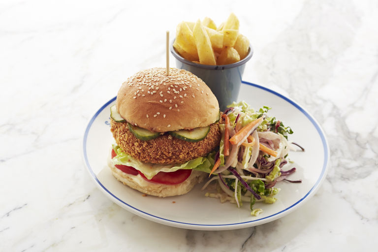 Chickpea and coriander veggie burger with chips and coleslaw