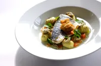 Steamed fillet of sea bream with a nage of Cornish oyster, tomatoes and cucumber and herb gnocchi