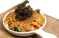 Vegetable and chestnut stew with sage crust and crispy kale