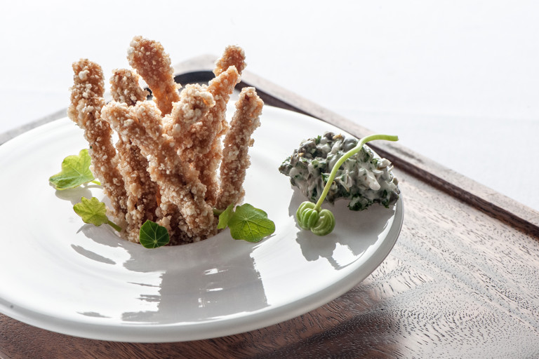 Crispy pig's ears with nasturtium and caper tartare sauce
