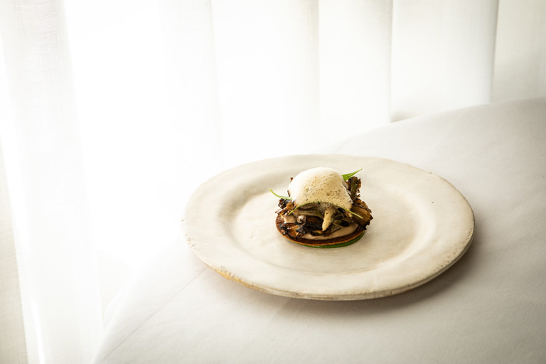 Grilled maitake mushroom tart, cep cream, wild garlic and a beer and yeast sauce