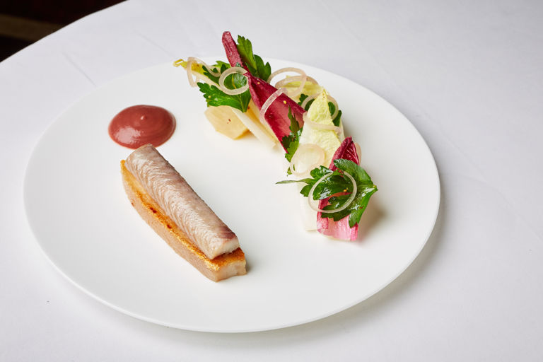 Slow-cooked suckling pig with smoked eel, beetroot, chicory and red apple