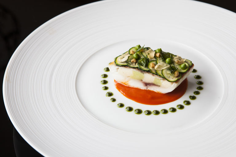 Fillet of sea bream stuffed with scallop mousse, piquillo pepper and pine nuts