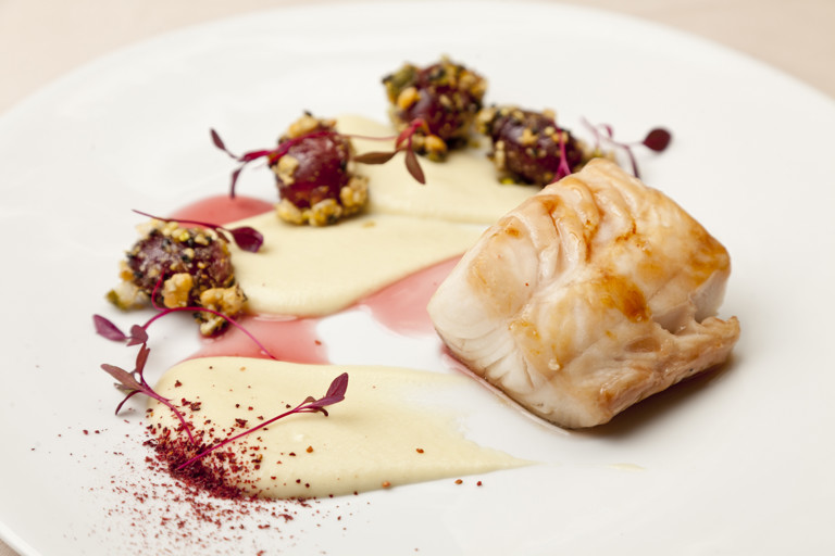 Glazed Alaska black cod with a verjuice sauce and crunchy grapes